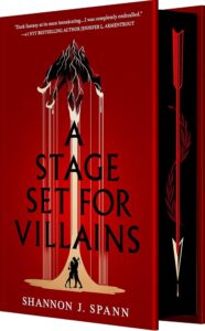 The cover is blood red and has a mountain range at the top. The bottom of the mountain turns into fingers with golden sand running down like puppet strings. At the bottom are shadows of a boy and girl hugging.