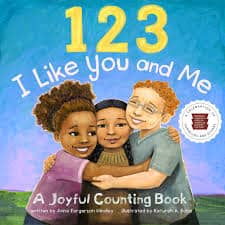 An illustration of three children hugging. There is a girl with dark skin and brown curly hair, a boy with light skin, curly red hair, and glasses, and a girl with tan skin and long black hair.