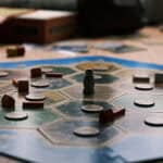 The board game Catan with pieces on an octagon-shaped board